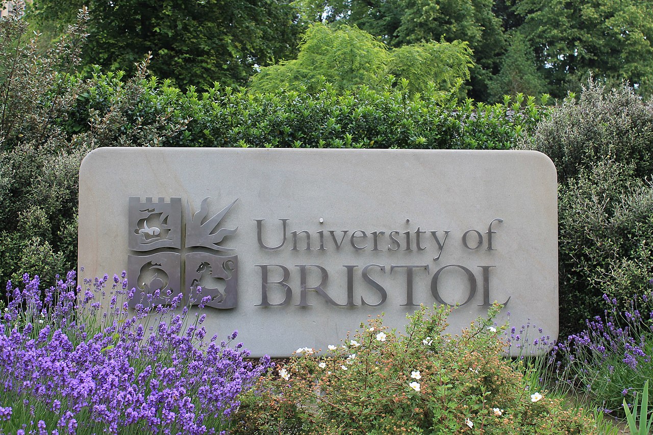 A photo of a stone "university of Bristol" sign