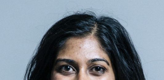 Official press portrait photograph of Suella Braverman