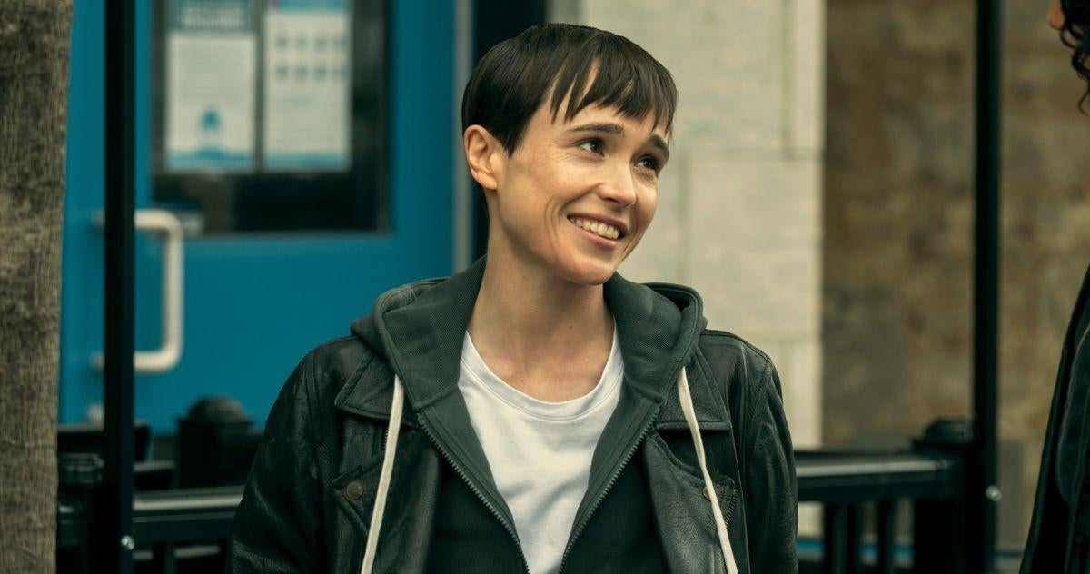 Screenshot of Viktor Hargreeves (Elliot Page) in The Umbrella Academy Season 3; with the cheesiest happiest grin you ever did see