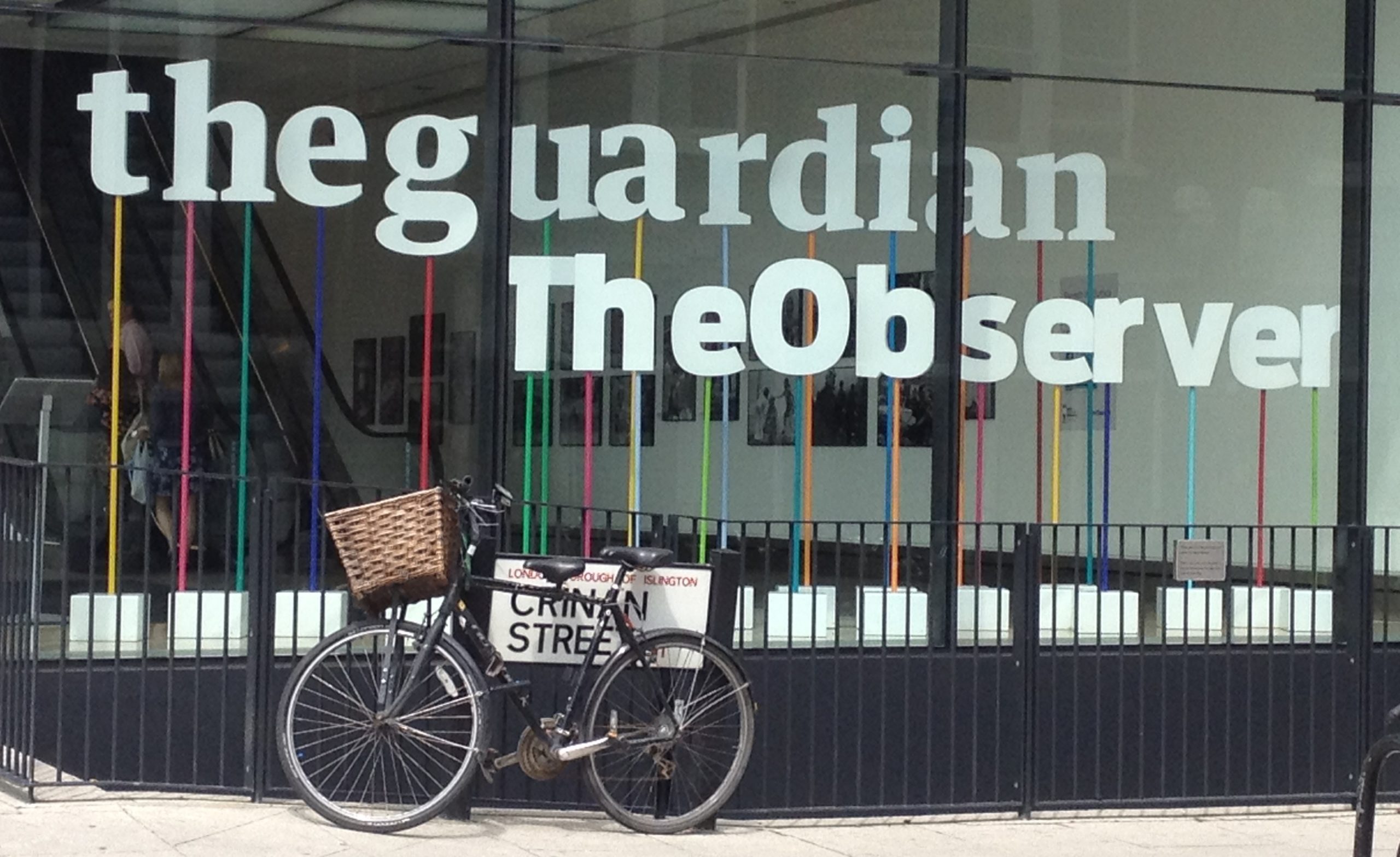 The Guardian/The Observer building in London, where Nick Cohen has been suspended from. It shows their logos in the window with a bicycle chained t...