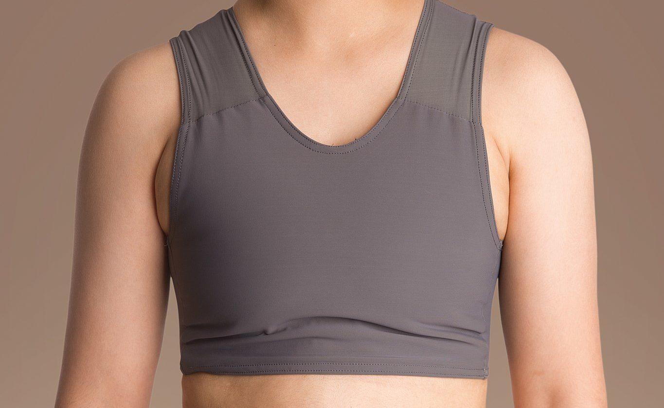 an image of someone chest binding