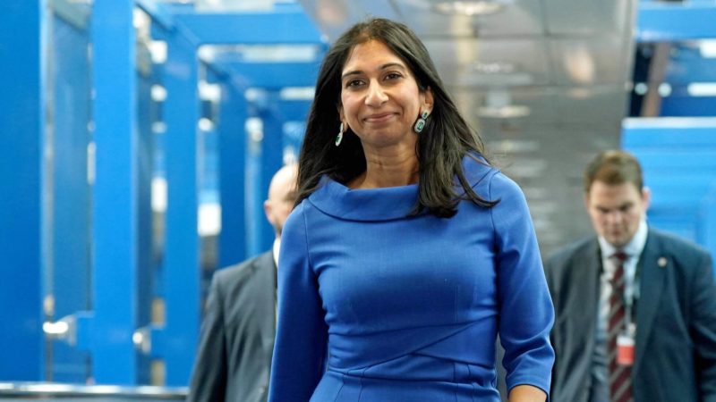 Suella Braverman in a blue dress