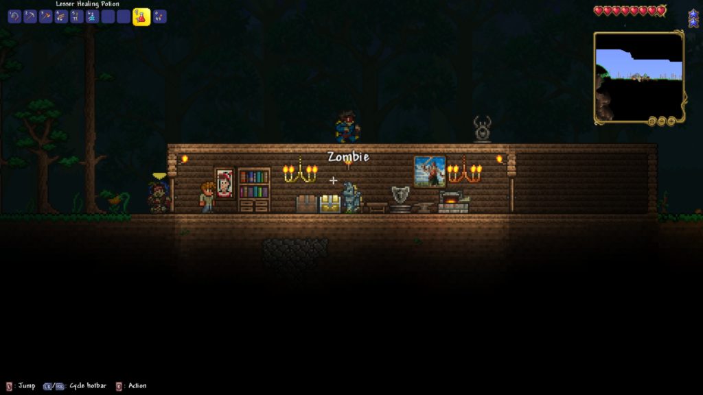 My house being attacked at night in Terraria