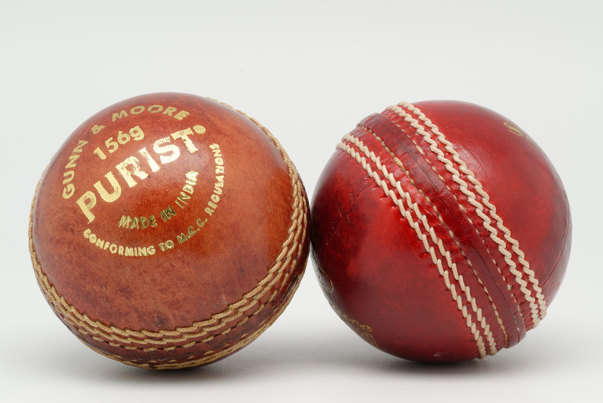 Two cricket balls to illustrate the question "should I cut off my balls"?