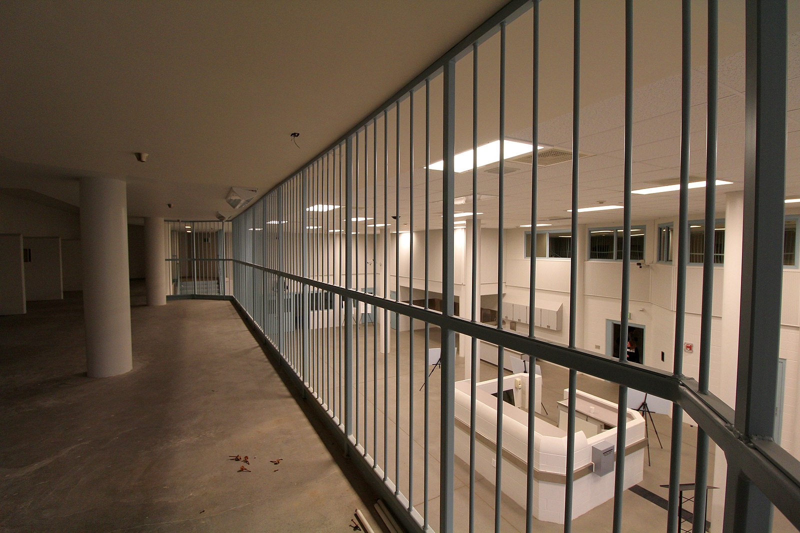 An image taken inside of a prison showing barred walls looking over a common area. This to illustrate the story surrounding transgender rapists lik...