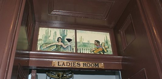 A sign reading "ladies room" above the door to a women's bathroom. This is from The St James Hotel but I imagine its not far off what the signage in the Marquis of Granby looks like which is why I am okay using it for our penis woman story.