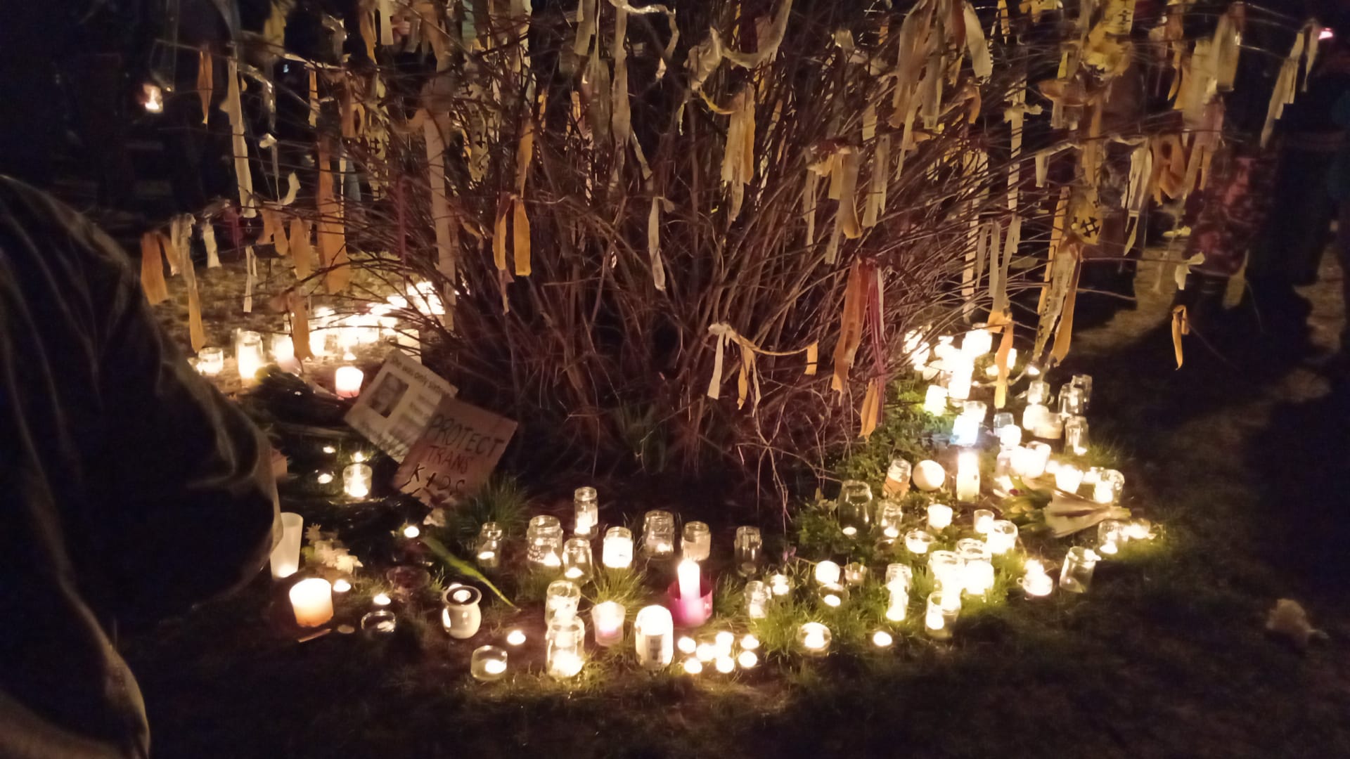 What is a vigil? An image taken from a vigil in Bristol to mark the death of Brianna Ghey. It shows a tree with a ribbon for every victim of anti-t...