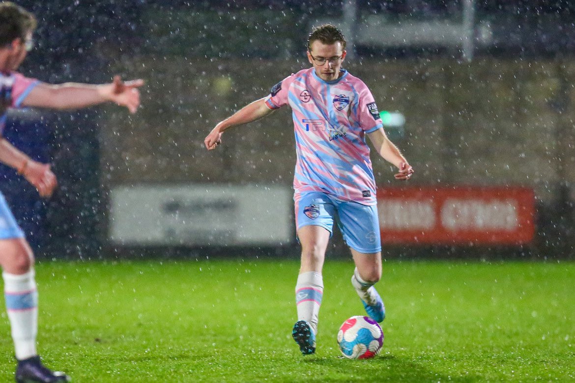 A photo of Arthur Webber, captain of the first all trans masc football team in Europe with the ball. Photo by Lucy Copsey (@lucycopsey_98 on Twitter)
