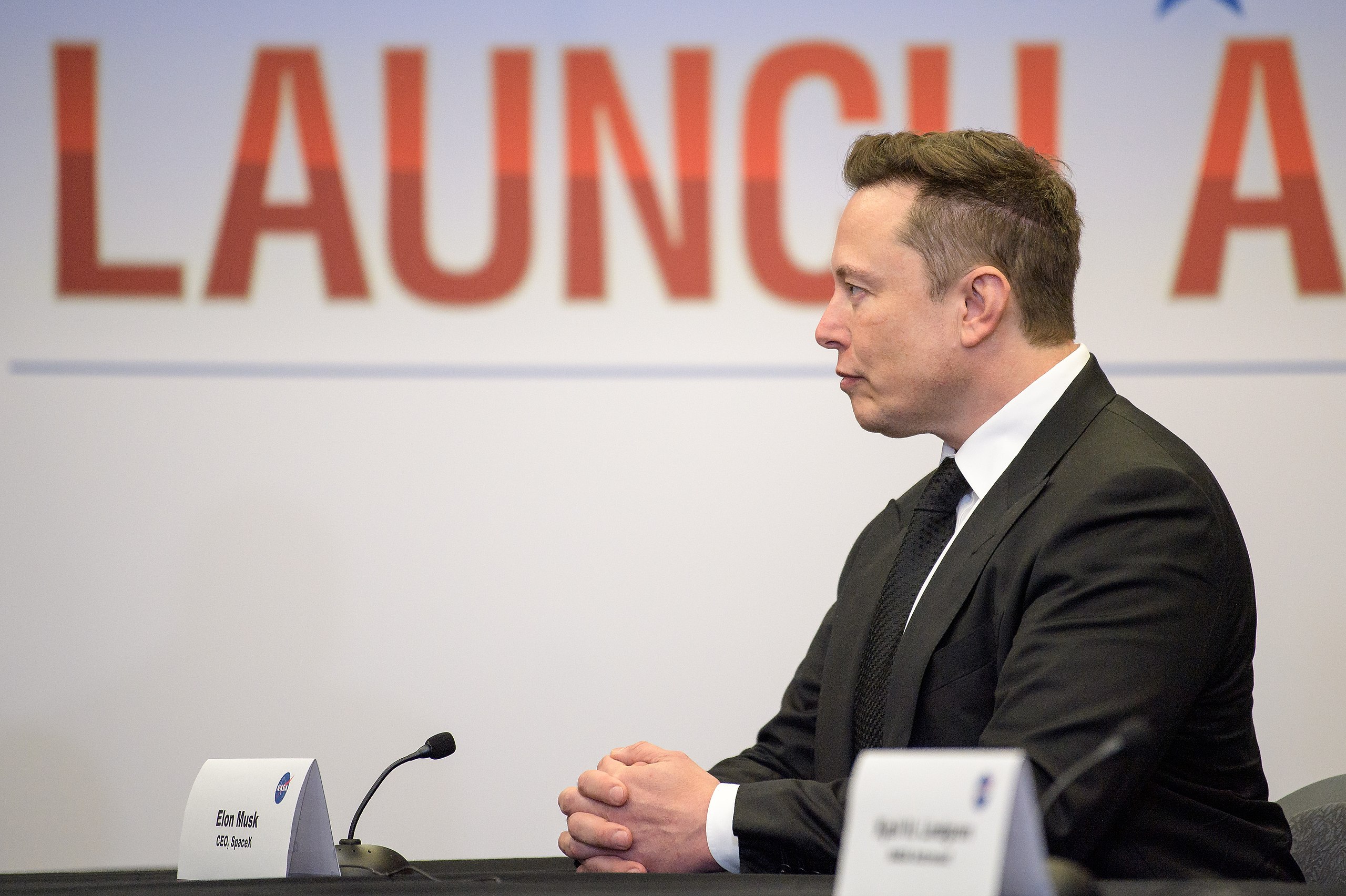 A side profile photo of Elon Musk. Source NASA/Bill Ingalls. Ps Elon Musk is cisgender.