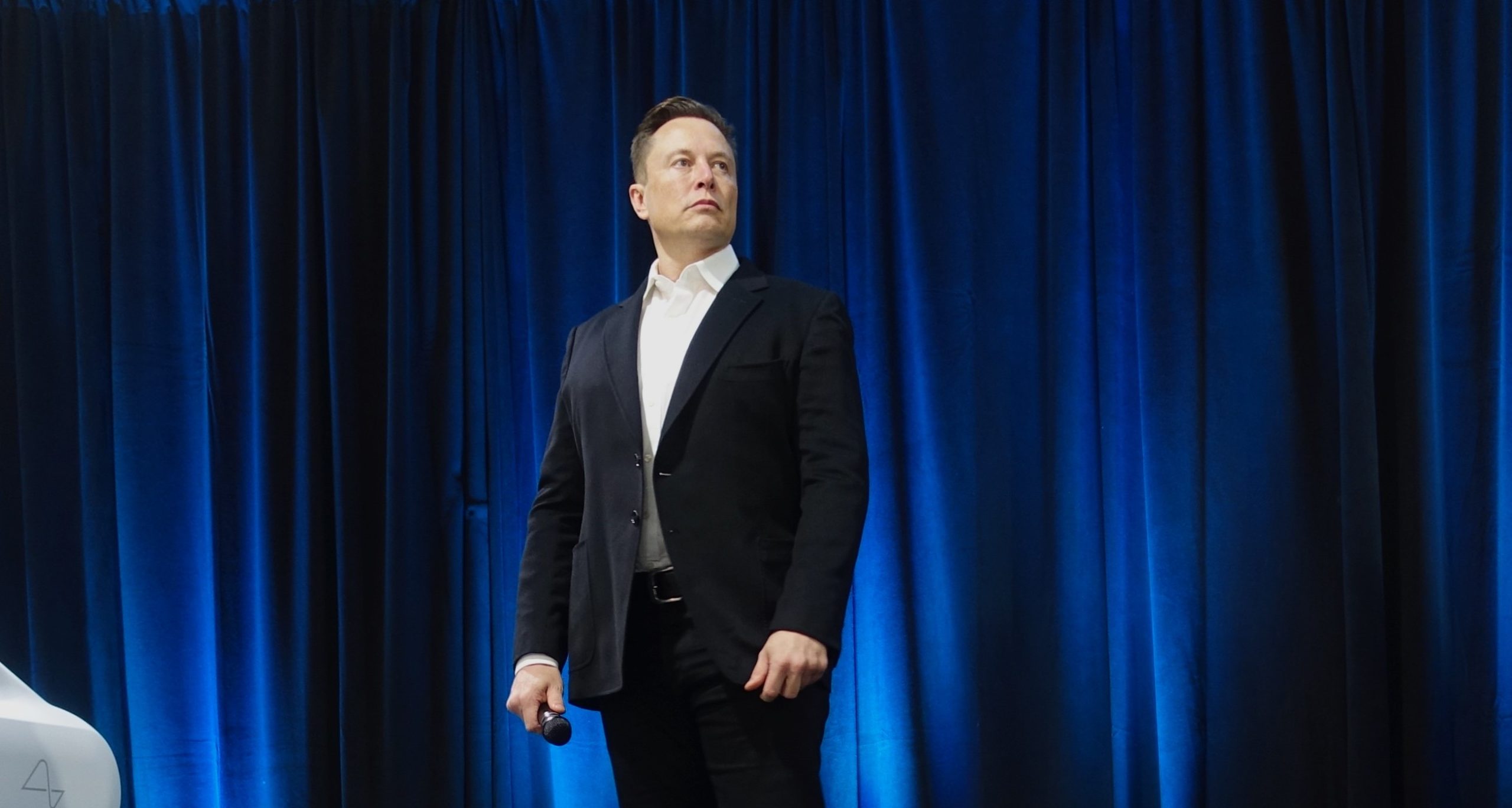A photo of Elon Musk who owns Twitter and set the direction for the brand which has enabled Transphobes on Twitter to plan to gate crash a funeral....