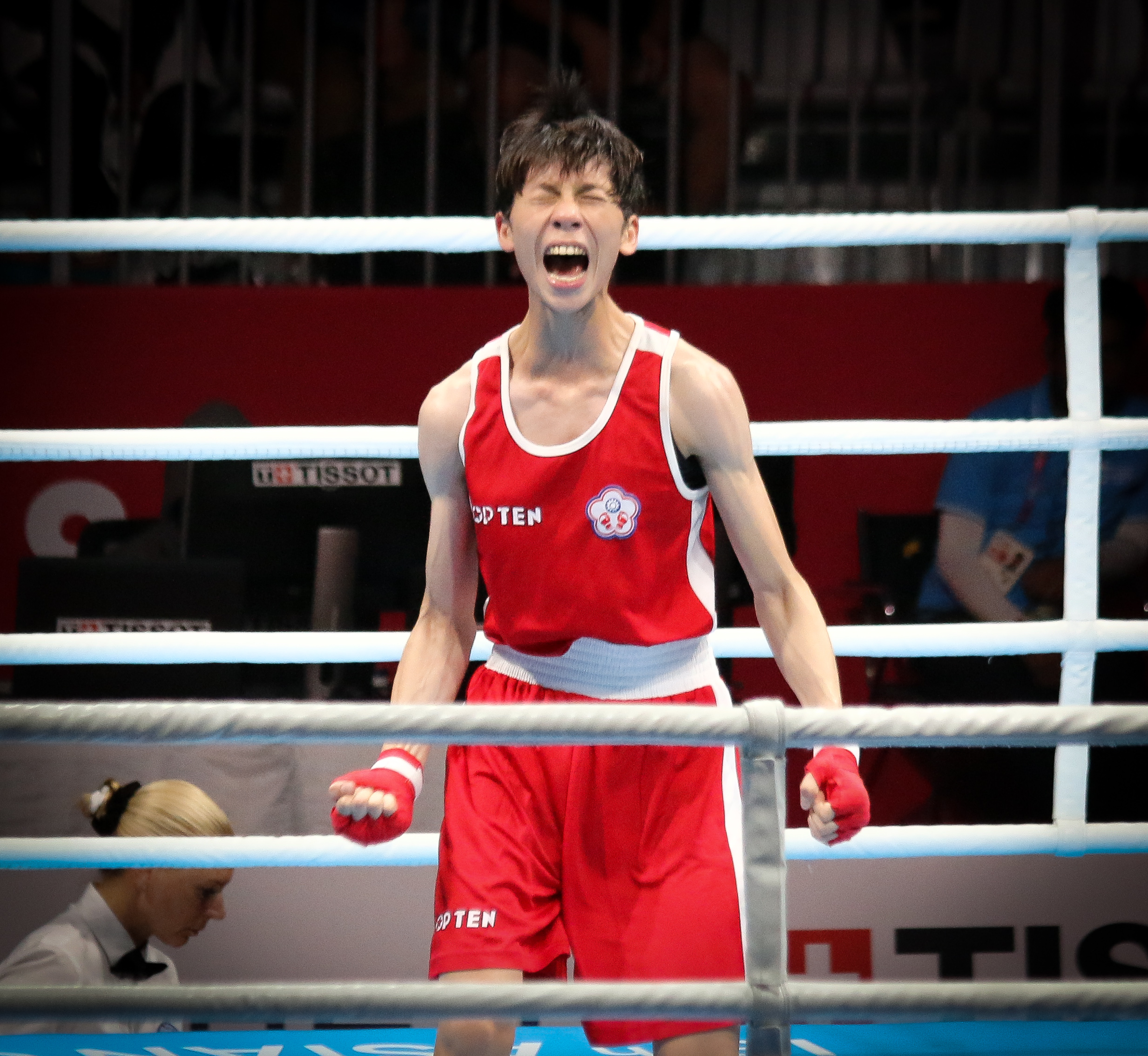 A photo of Lin Yu-Ting in the ring doing a big yell or scream. Transphobic comments about the athlete made by Rowling have result in Taiwan cancell...