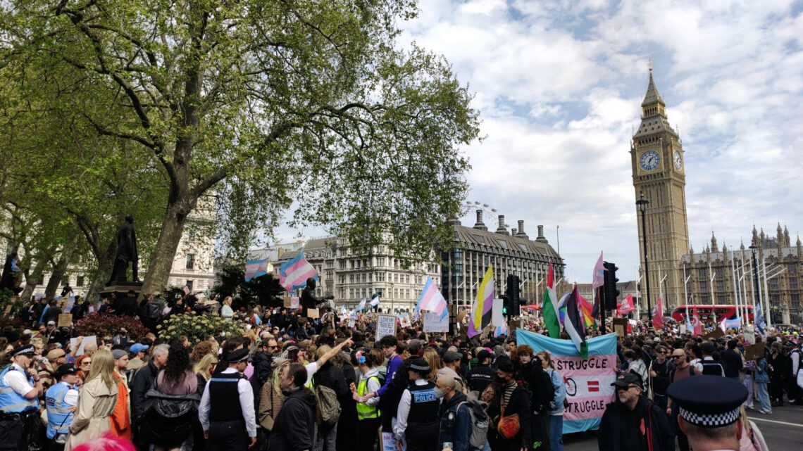 A protest against the Supreme Court by transgender people and allies. Thousands of people are pictured outside the House of Parliament with Big Ben...