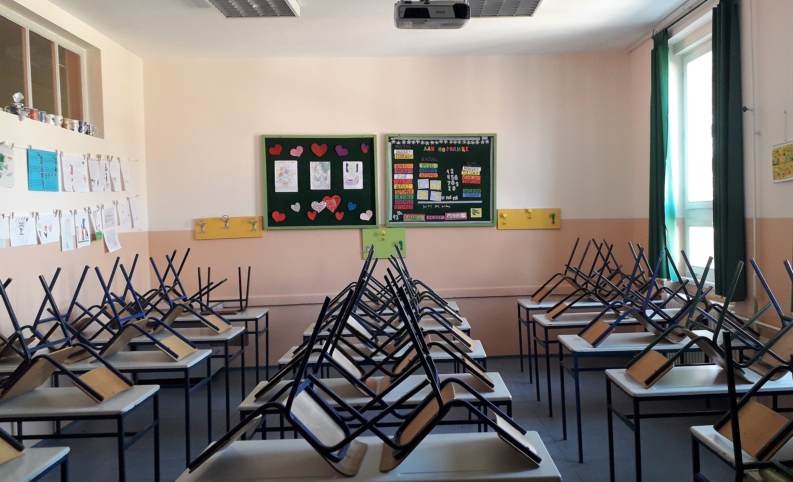 Image of a classroom with chairs stacked on top of the desks. Almost certainly not the one Kevin Lister was fired from.