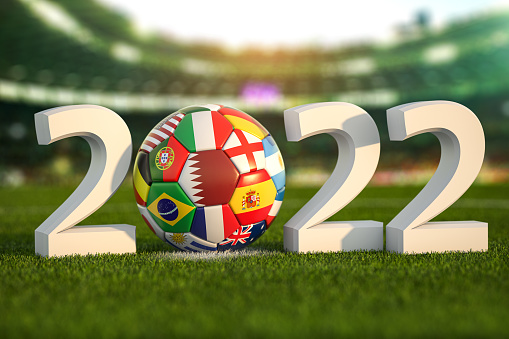Football world championship 2022 in Qatar. Soccer ball with flags of world countries on the grass field of football stadium. . 3d illustration