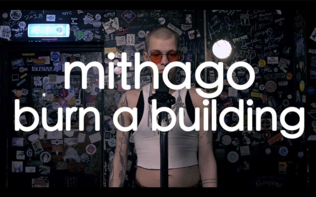 Title card for Mithago Burn A Building, photo by Scroobius Pip and team