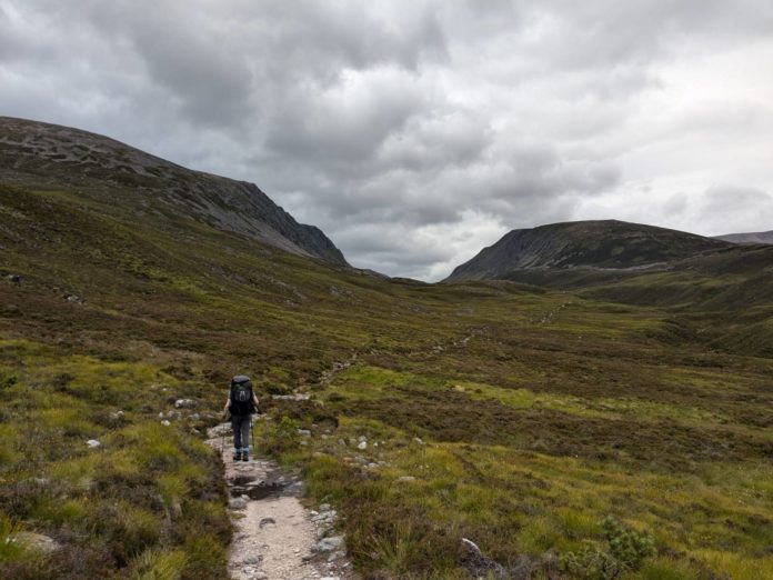 A photo of Jay Hulme walking in the Cairngorms